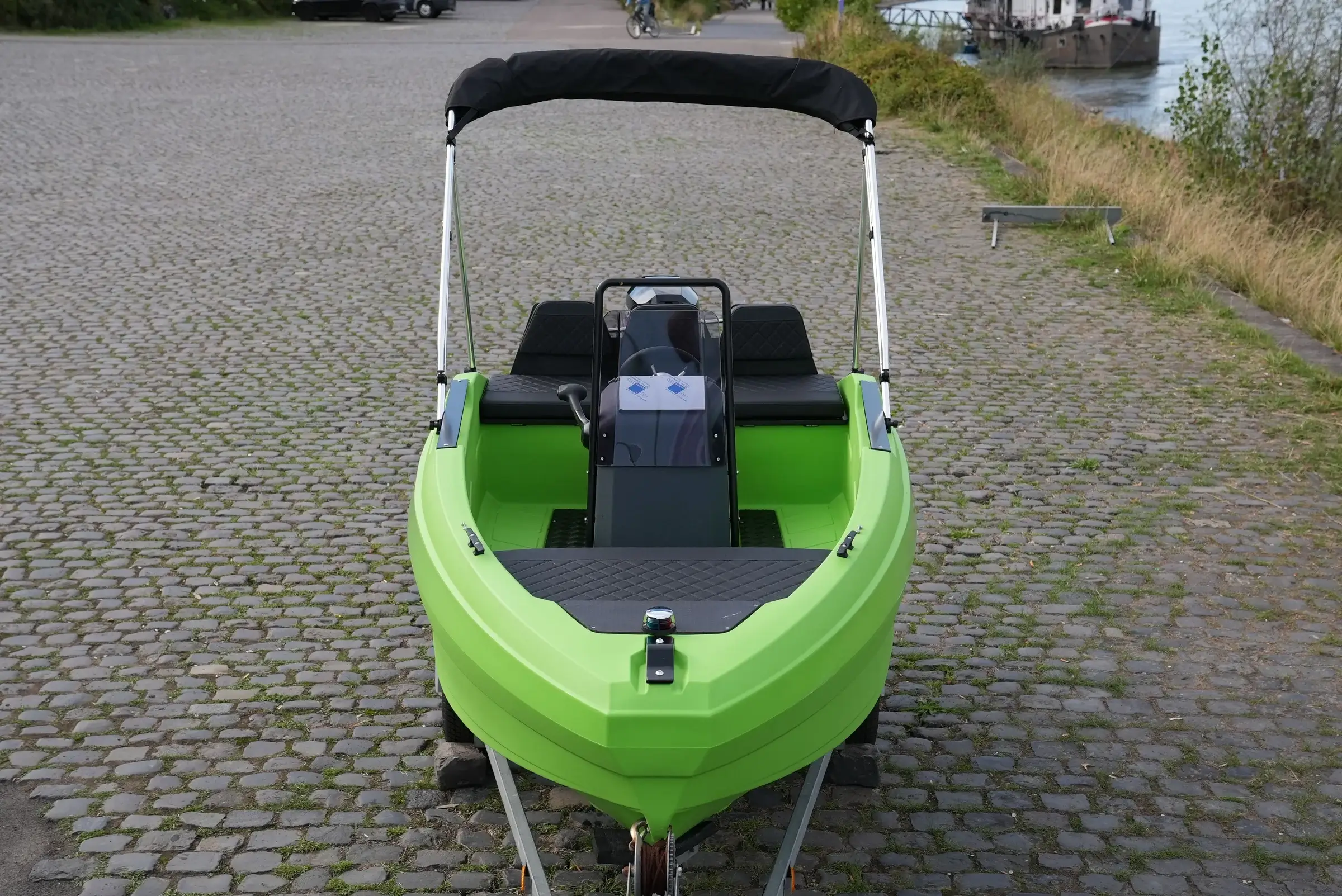 SeaStorm 12 from the front with bow cushion, console and bimini