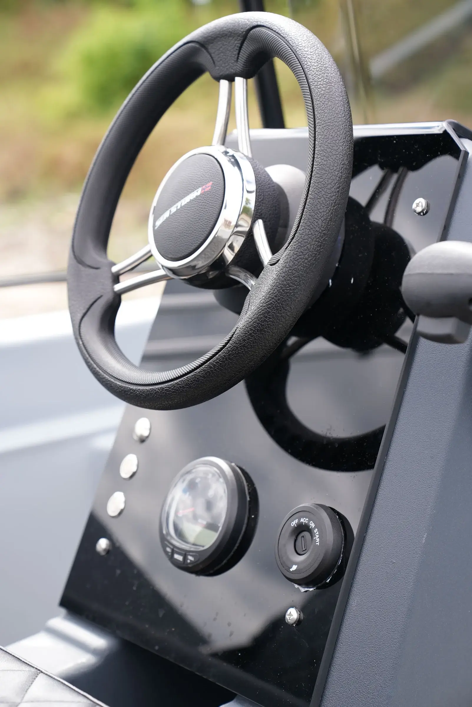 Helm of the SeaStorm 13s with steering wheel and instruments