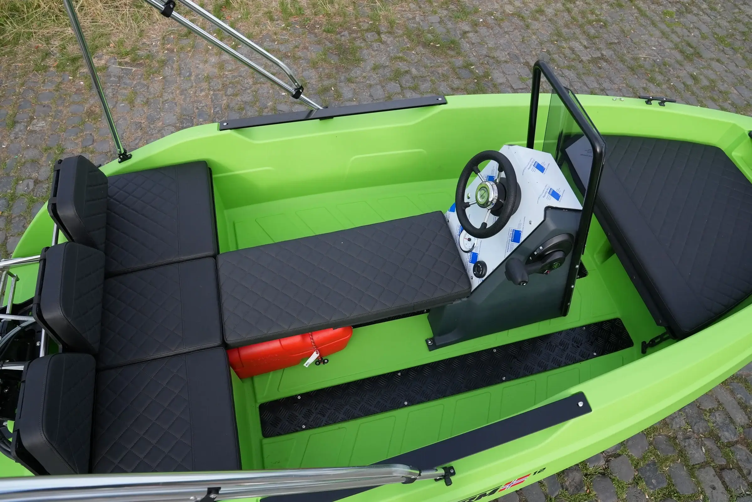 Seating area of the SeaStorm 12 with black cushions